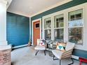 Inviting front porch featuring comfortable seating and stylish decor at 917 W Alfred St, Tampa, FL 33603