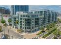 Corner view of a six-story condo building with a coffee shop at 111 N 12Th St # 1614, Tampa, FL 33602