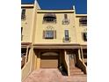 Charming townhome featuring a well-maintained facade, private garage, and inviting entryway at 1720 Lighthouse S Ter # 8, South Pasadena, FL 33707