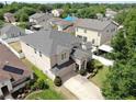 Aerial view of a two-story home with a well-manicured lawn and landscaping in a residential neighborhood at 312 Taxter Run Ln, Valrico, FL 33594