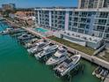 Waterfront condo complex featuring boat slips, gorgeous water views and a community pool at 415 Island Way # 205, Clearwater Beach, FL 33767