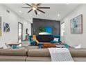 Bright living room featuring modern decor, stylish furniture, and a unique accent wall with decorative geometric paneling at 511 45Th N Ave, St Petersburg, FL 33703