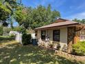 Secluded backyard with a white fence and tasteful landscaping at 5905 Caroline Dr, Wesley Chapel, FL 33545