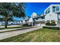 Charming townhouse with well-kept lawns, attached garage, and neatly trimmed hedges at 14723 Seminole Trl, Seminole, FL 33776