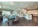 Open concept floor plan showing the dining area, kitchen, breakfast bar, and living room at 2024 Sidney St, Clearwater, FL 33763