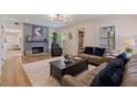 Inviting living room boasts hardwood floors, a cozy fireplace, and comfortable seating for relaxation and entertainment at 7120 3Rd N Ave, St Petersburg, FL 33710