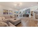 Bright living room featuring hardwood floors and an adjoining dining room with abundant sunlight at 7120 3Rd N Ave, St Petersburg, FL 33710