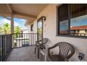 Cozy condo balcony with chairs, perfect for enjoying the outdoors at 9910 Eagles Point Cir # 3, Port Richey, FL 34668