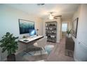 Well-lit home office space with a sleek desk, shelving, and modern decor at 1038 Ocean Spray Dr, Ruskin, FL 33570