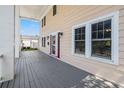 Wide view of the front porch area showcasing windows and a red front door at 1842 Nebraska Ne Ave, St Petersburg, FL 33703
