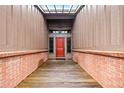 Inviting home entrance with a brick-lined walkway leading to a striking red front door at 1916 38Th W St, Bradenton, FL 34205