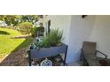 Peaceful back patio with a raised garden bed, perfect for enjoying outdoor living at 1960 Lakewood Club Dr S # 2-F, St Petersburg, FL 33712