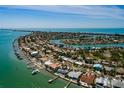 Aerial view of waterfront community, showcasing the house's location with water views and neighborhood at 2972 E Vina Del Mar Blvd, St Pete Beach, FL 33706