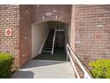 Covered entrance with brick archway, stairs, and well-maintained walkway at 3585 41St S Ter # 227, St Petersburg, FL 33711