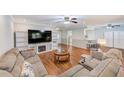 Open living room featuring a fireplace, built-in shelves, and a breakfast bar at 533 Keene Rd, Largo, FL 33771