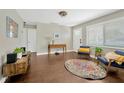 Inviting living room featuring sleek floors, a console table, and comfortable modern furnishings at 5367 5Th N Ave, St Petersburg, FL 33710