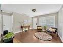 Cozy living room showcasing hardwood floors, lots of natural light, and comfortable seating at 5367 5Th N Ave, St Petersburg, FL 33710