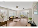 Bright open-concept living area featuring hardwood floors, comfortable seating, and lots of natural light at 5367 5Th N Ave, St Petersburg, FL 33710