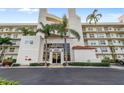 Exterior view of the condo building's entrance with palm trees and well-maintained landscaping at 6021 Bahia Del Mar Cir # 534, St Petersburg, FL 33715