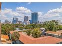 Stunning skyline view from the top of a building, offering a glimpse of downtown through lush green trees at 750 Burlington N Ave # 4L, St Petersburg, FL 33701
