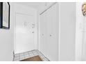 Bright entryway with tile floor, a coat closet and a white door offering a clean, welcoming space at 10365 Paradise Blvd # 4, Treasure Island, FL 33706