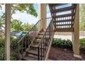 Stairway view with landscaping alongside, leading to upper level condos at 12293 Sailwinds Dr # 206, Largo, FL 33773