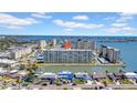 Beautiful aerial view of a waterfront condo complex with stunning views, boat docks, and well-manicured landscaping at 4725 Cove Cir # 302, St Petersburg, FL 33708