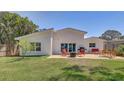 Beautiful backyard featuring an outdoor kitchen, seating, and a paver patio at 9100 2Nd N St, St Petersburg, FL 33702