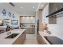Well-appointed kitchen with a sleek cooktop, oven, wine cooler, and breakfast bar, ideal for entertaining at 100 1St N Ave # 1005, St Petersburg, FL 33701