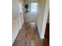 Inviting foyer with tile floors transitions to the expansive carpeted living area with a view to the exterior at 10316 Carrollwood Ct # 57, Tampa, FL 33618