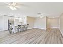 Spacious kitchen with stainless steel appliances and a bar that overlooks the living area, great for entertaining at 1203 16Th Se Cir, Largo, FL 33771