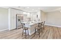 Bright modern kitchen featuring stainless steel appliances and a central island with breakfast bar seating at 1203 16Th Se Cir, Largo, FL 33771