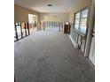 Spacious living room with large windows and potential for renovation, offering a blank canvas for customization at 195 45Th Ave, St Pete Beach, FL 33706
