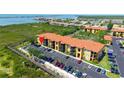 Stunning aerial view of the condo complex with lush surroundings, showcasing its prime waterfront location at 4302 Bayside Village Dr # 102, Tampa, FL 33615