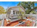 Classic home with stone and siding, complemented by a small front yard and mature trees in a quiet neighborhood at 1209 E 29Th Ave, Tampa, FL 33605