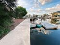 View of an old dock, walkway, and canal that offers a glimpse of the property's waterfront access at 13930 King Ave, Hudson, FL 34669