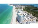 Breathtaking aerial view of the beachfront condo building near the ocean at 1750 Benjamin Franklin Dr # 11G, Sarasota, FL 34236