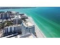 Stunning aerial view of the beachfront condo building with private beach access at 1750 Benjamin Franklin Dr # 11G, Sarasota, FL 34236