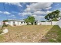 Spacious backyard with a patio area, perfect for outdoor entertaining at 2605 Fulton Sw St, Largo, FL 33774