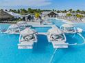 Aqua Lounger cabanas in the refreshing pool, offering a unique relaxation experience at 31649 Tansy Bnd, Wesley Chapel, FL 33545