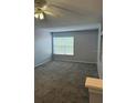 Spacious bedroom filled with natural light, thanks to the large window and a ceiling fan at 5904 Willow Ridge Dr # 202, Zephyrhills, FL 33541