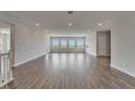 Spacious living room featuring hardwood floors, recessed lighting and large windows with scenic views at 814 Manns Harbor Dr, Apollo Beach, FL 33572