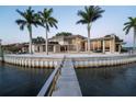Spectacular waterfront home with lush landscaping, private dock, and architectural design, creating an inviting retreat at 10 Brightwaters Ne Cir, St Petersburg, FL 33704