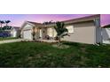 Charming home with green lawn, updated landscaping, and cozy outdoor seating area at 10884 118Th St, Seminole, FL 33778