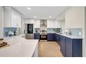 Modern kitchen features white cabinets, stainless steel appliances, and backsplash detail at 10884 118Th St, Seminole, FL 33778