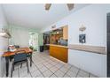 Eat-in kitchen featuring stainless steel appliances, and view to the backyard at 11831 104Th Ln, Largo, FL 33773