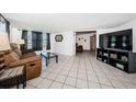 Cozy living room with tile flooring, neutral walls, and comfortable seating area at 11831 104Th Ln, Largo, FL 33773