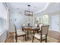 Formal dining room featuring modern lighting, stylish accents, and neutral colors at 11911 Greenchop Pl, Riverview, FL 33579
