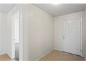 Inviting entryway with neutral walls, tile flooring, and a view into the home at 16139 Villa Dr, Hudson, FL 34667