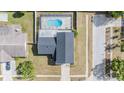 Aerial shot of home showing screened pool, gray roof, proximity to street and neighboring properties at 206 Soldier Ct, Seffner, FL 33584